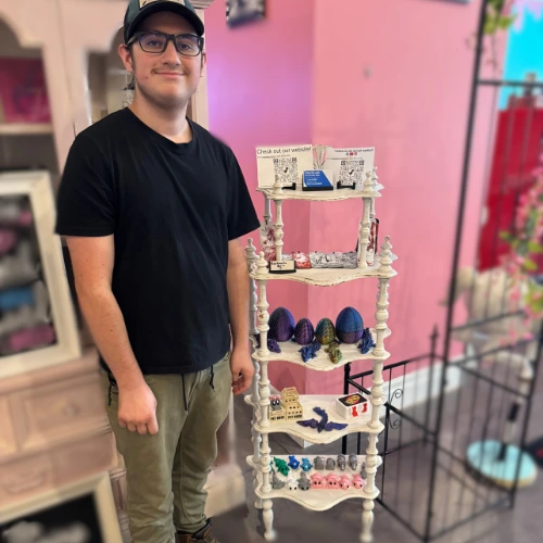 Lucas (The Owner of Createlabs) in front of his shelf at Reel Treats